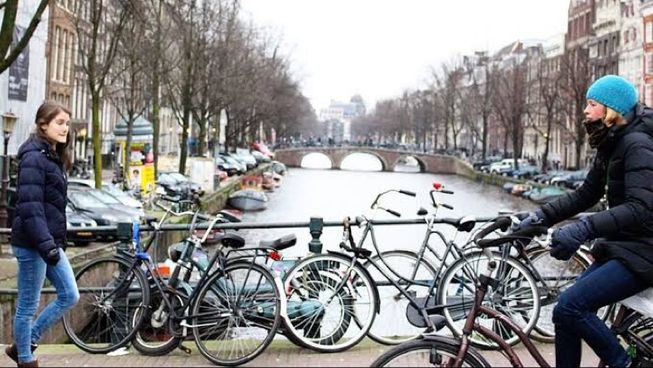 Riding Bikes In Amsterdam Amsterdam North Holland
