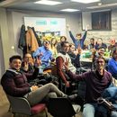 Couchsurfers meet up and board game, quiz playing's picture